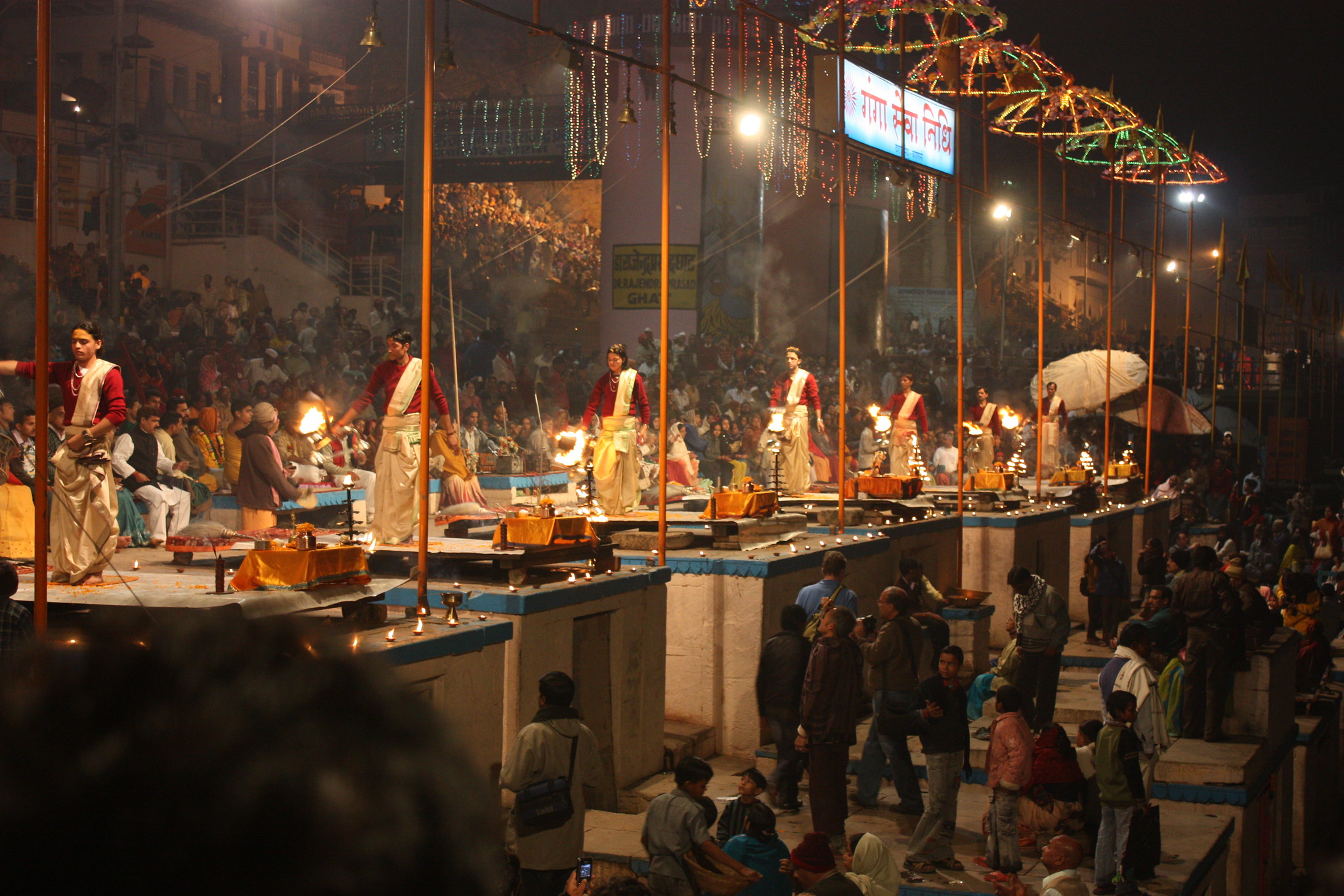 Devotees immerse themselves in the sacred waters of the Ganges River at the iconic Dashashwamedh Ghat in Varanasi.